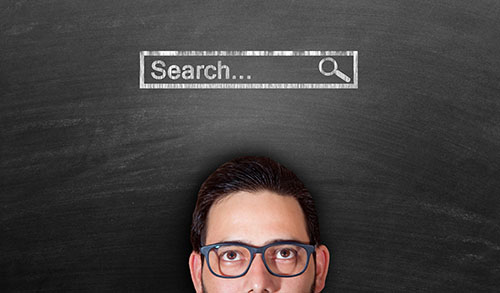 Man looking at blackboard to explain why search engine optimisation (SEO) is critical for companies and businesses