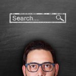 Man looking at blackboard to explain why search engine optimisation (SEO) is critical for companies and businesses